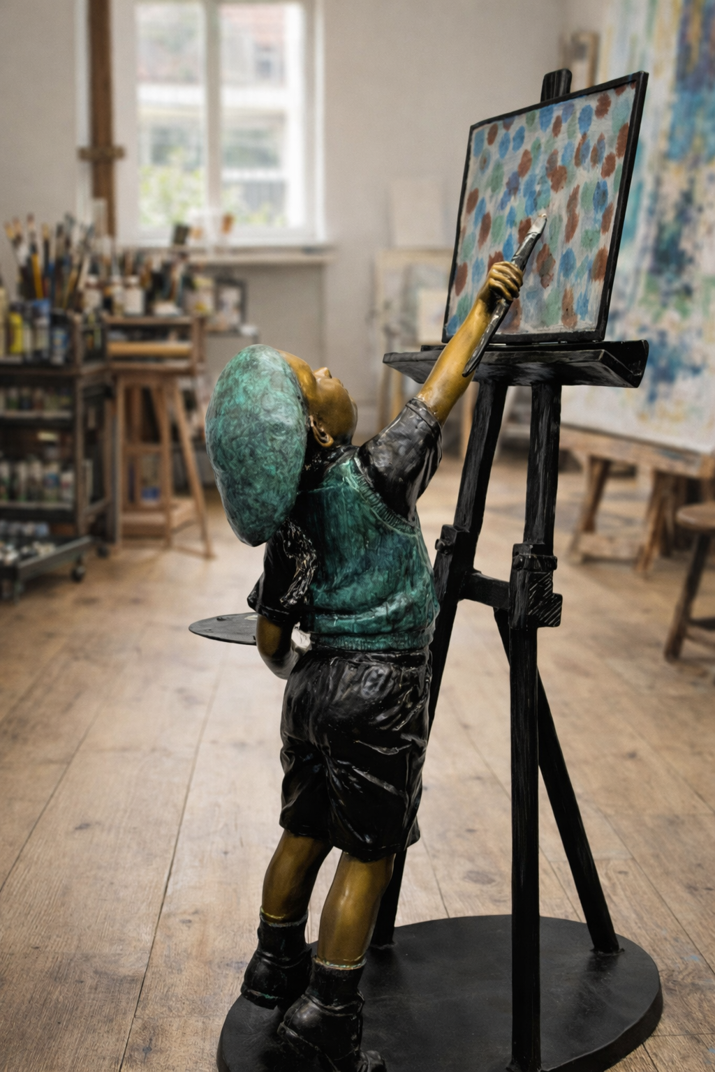 bronze child painting like picasso
